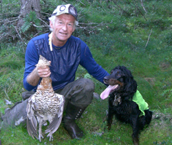 Grouse hunting with standing dog